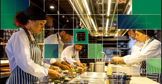Chef team working together in an organized environment, illustrating how a strong technology foundation keeps operations running smoothly during growth.
